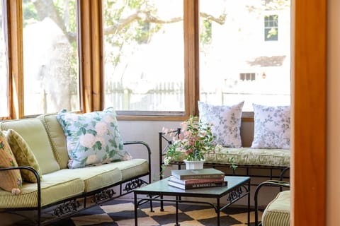 Thoughtfully designed screened in porch with plenty of seating 