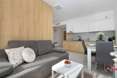 Relax in the stylish living room with a comfortable sofa and modern decor.