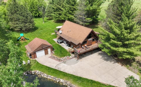 Pond view home with large yard