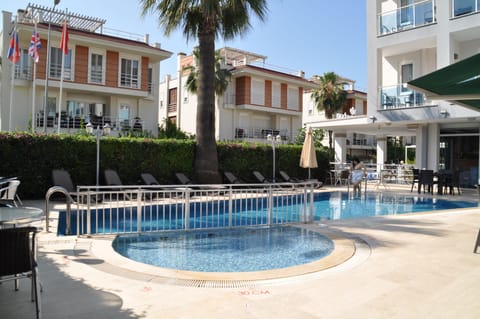 Seasonal outdoor pool, pool umbrellas, sun loungers