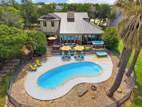 Our gorgeous freeform pool and expansive outdoor living space set the perfect scene for lazy afternoons, family swim sessions, and unforgettable evenings under the Texas sky. 