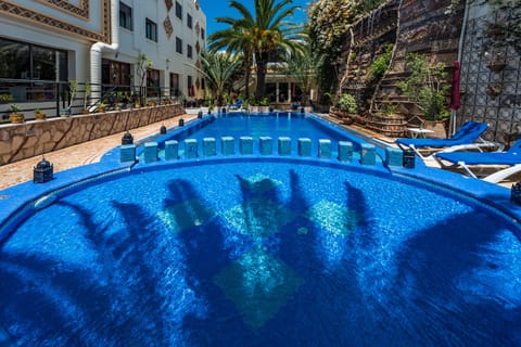 Outdoor pool, open 8:00 AM to 7:00 PM, pool umbrellas, sun loungers