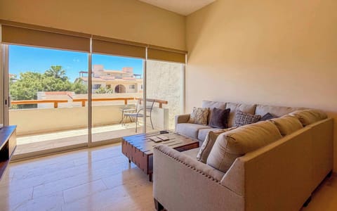 Relax in the inviting living room with plush, cozy seating.