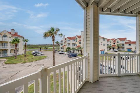 Private balcony with views of the property and surrounding coastal neighborhood.