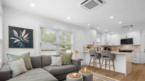 Open sightlines from the living room to the kitchen keep the whole group connected, whether cooking or catching up.