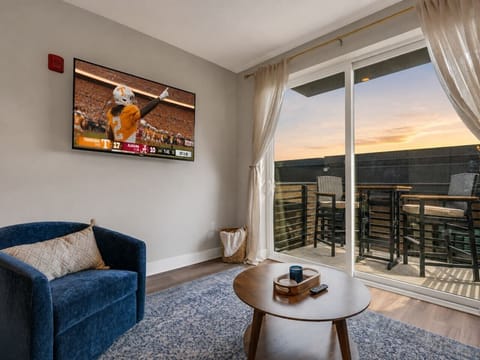 Living Room: Kick back and catch the game while soaking up stunning sunset views!