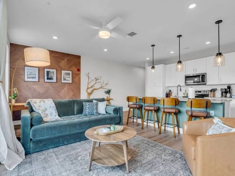 Living Room: Bright and modern space with stylish seating and a vibrant kitchen bar for gatherings!