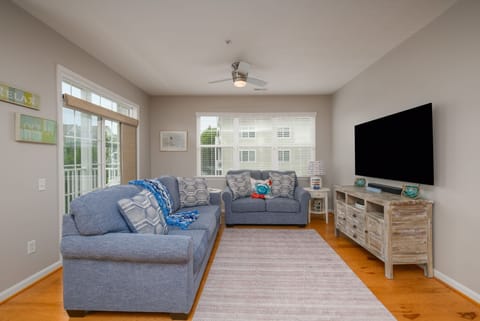 Living Room with Large Smart TV and Sleeper