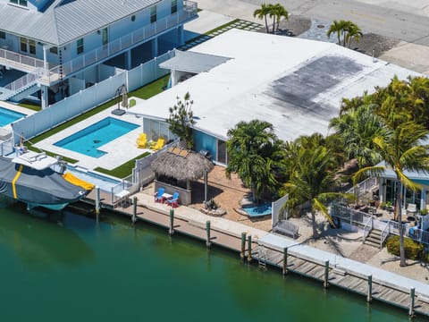 This 3-bedroom, 2-bath Key Colony Beach half-duplex offers private dockage, a tiki hut, kayaks, pet-friendly accommodations, and Cabana Club access for a true Florida Keys getaway.