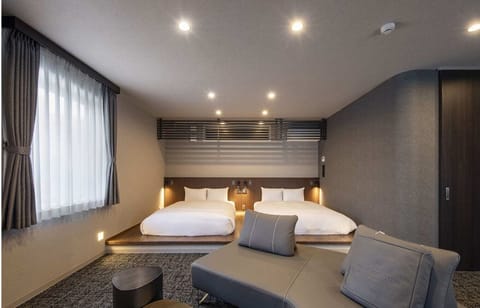 Deluxe Twin Room, Non Smoking | Desk, laptop workspace, blackout drapes, soundproofing