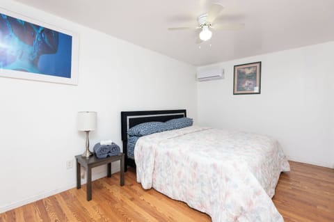 Masters bedroom with half toilet, California king size bed, private space. 