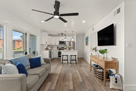 Welcome home to a bright, modern open-concept floor plan designed for effortless coastal living.