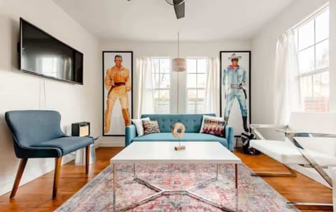 Living room with TV and plenty of seating 