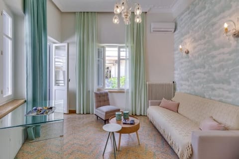Deluxe House, Patio, Garden View | Living area | 50-inch Smart TV with satellite channels, Netflix, streaming services