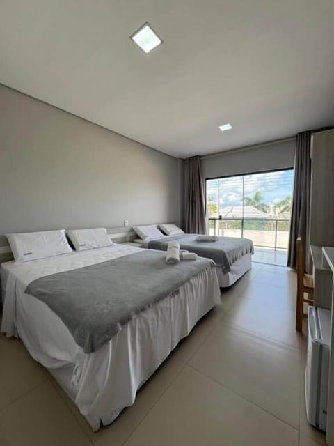 Quadruple Room, City View | Desk, laptop workspace, free WiFi, bed sheets