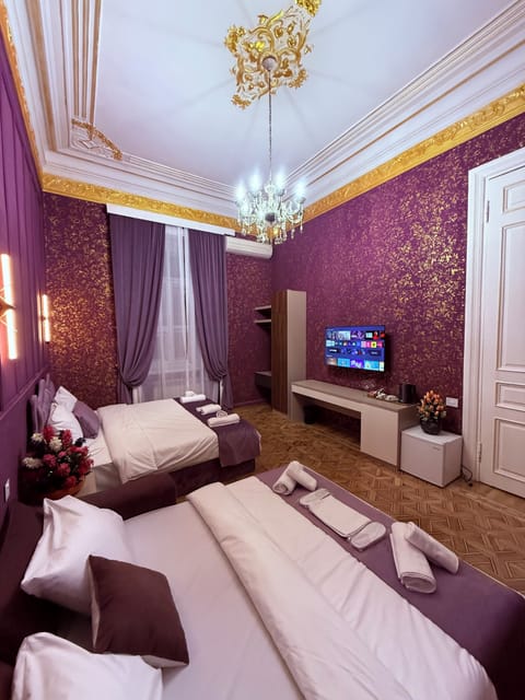 Family Suite, City View | Desk, laptop workspace, iron/ironing board, free WiFi