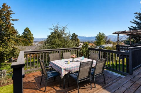 Enjoy al fresco dining on the spacious deck, complete with outdoor seating, a BBQ grill, and scenic mountain views.