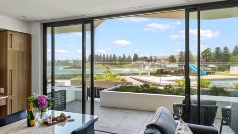 Dining room with views of the pool area overlooking Surf Beach