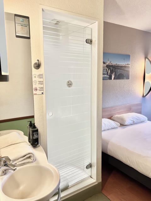 Shower, rainfall showerhead, eco-friendly toiletries, hair dryer