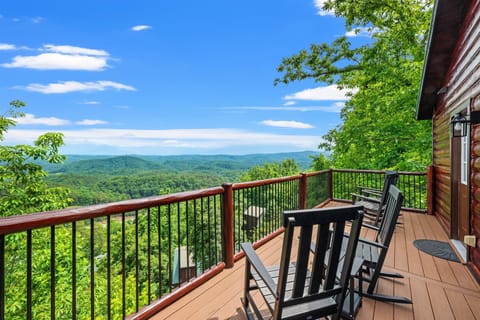 Four rocking chairs, one sweeping view.  This porch is located out the top floor bedroom — enjoy your morning coffee watching the sunrise or evening cocktail under the stars.