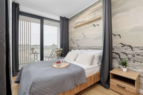 Comfortable double bed, and direct balcony access.