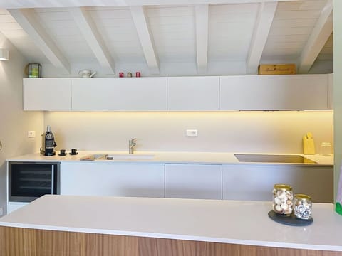 Kitchen, Interior Design, Flooring, Countertop, Wood, Ceiling, Floor, Cabinetry, Lighting, Kitchen Appliance