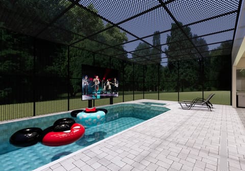Step outside to a refreshing pool area, enclosed for your comfort and privacy. Bright tiles sparkle in the sun, and colorful inner tubes invite you to relax and enjoy some fun in this perfect getaway.