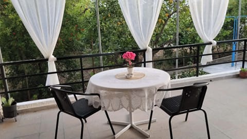 Spacious veranda with an outdoor dining table, perfect for your morning coffee o