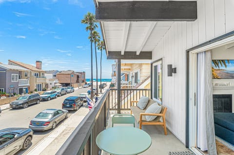 Front balcony with partial ocean views and coastal breezes
                