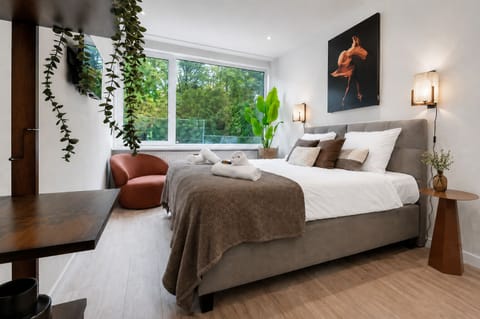 arge windows fill the room with natural light and beautiful garden views.