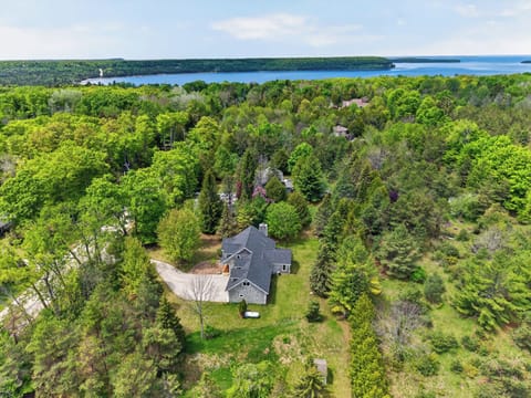 Welcome to Cottage on the Hill! Just 0.8 miles from downtown Ephraim, this aerial view looks west toward scenic Eagle Harbor and the village waterfront-putting Door County's shops, restaurants, and breathtaking sunsets just minutes from your doorstep