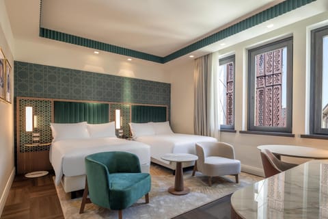 Premium bedding, down comforters, minibar, in-room safe