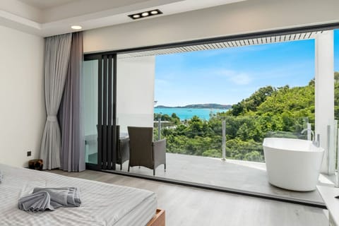 Stunning sea view terrace with modern outdoor seating at Villa J3, Replay Residence Bangrak Koh Samui