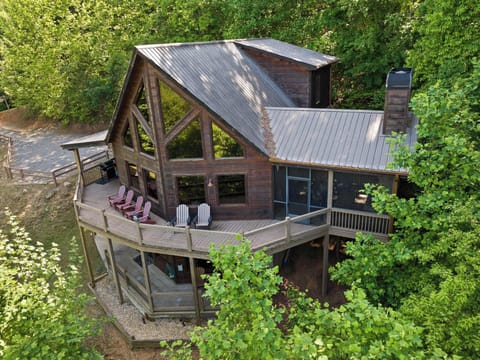 This stunning A-frame cabin with wraparound decks sits nestled in lush mountain forest — your secluded escape from the everyday. 