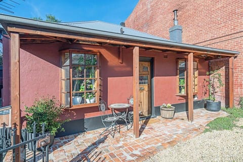 Admire the cottage's heritage façade, where period architecture and welcoming details reflect the character that defines this much-loved South Hobart neighbourhood.