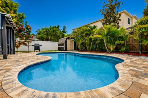 Enjoy your own sparkling private pool surrounded by tropical landscaping and a fully fenced yard.