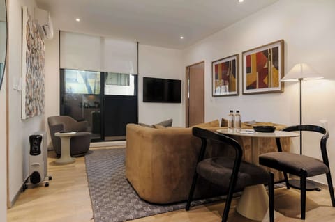 Cozy living area with space to relax and dine.
