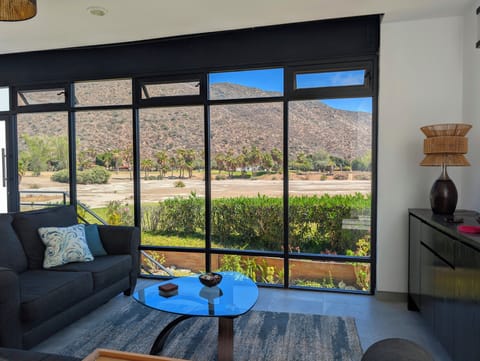 living room facing  the golf course. Lake view during the rainy season