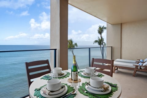 Enjoy coffee at sunrise or cocktails at sunset from the furnished lanai overlooking Maui's crystal-clear waters.