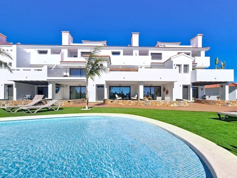 Bright 3-bedroom penthouse at Garden Golf Resort, Los Alcázares, featuring a spacious balcony with pool views and modern open-plan living.