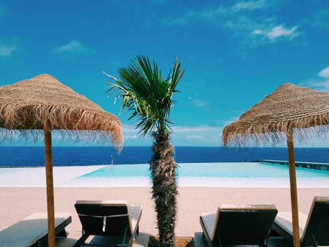 Indoor pool, outdoor pool, pool umbrellas, sun loungers