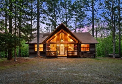 Framed by towering pines and a wide-open clearing, this charming cabin is the perfect launching point for your adventures.