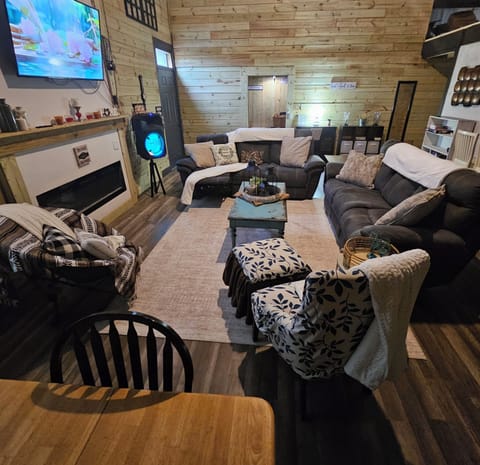 fireplace, interior, living area, smart TV, speaker, dining table