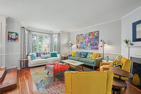 A vibrant living room bursting with color and character, perfect for a lively and welcoming stay!