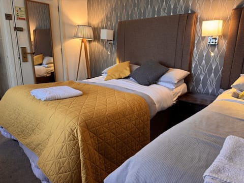 Triple Room, Private Bathroom, Garden View (3) | Iron/ironing board (on request), WiFi (free), bed sheets