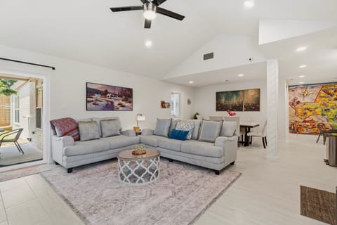 Bright and comfortable living room with Smart TV and plenty of seating.