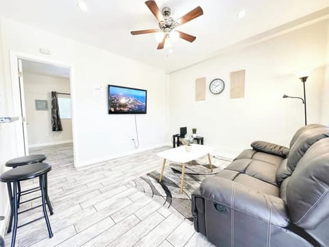 Bright Living Room with Smart TV & Cozy Seating 📺🛋️