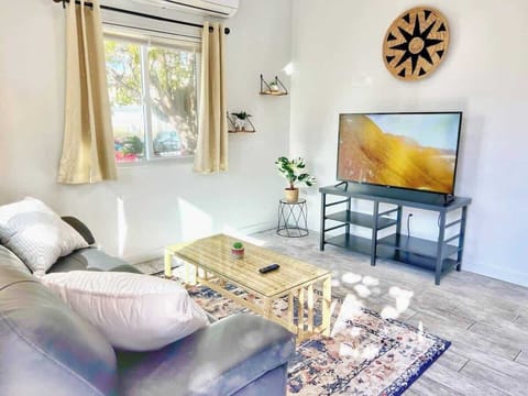 Bright Living Room with Smart TV & Cozy Seating 📺🛋️