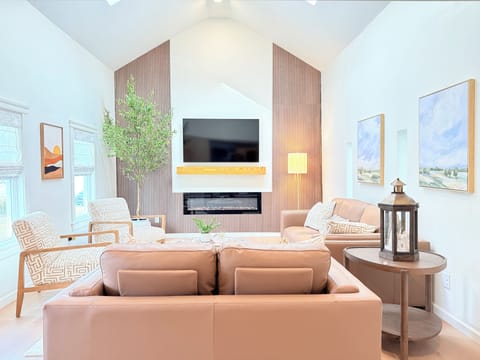 Vaulted ceilings, cozy fireplace, and space for everyone to unwind 