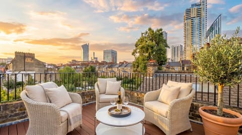 Unwind with breathtaking city views from your private terrace oasis.